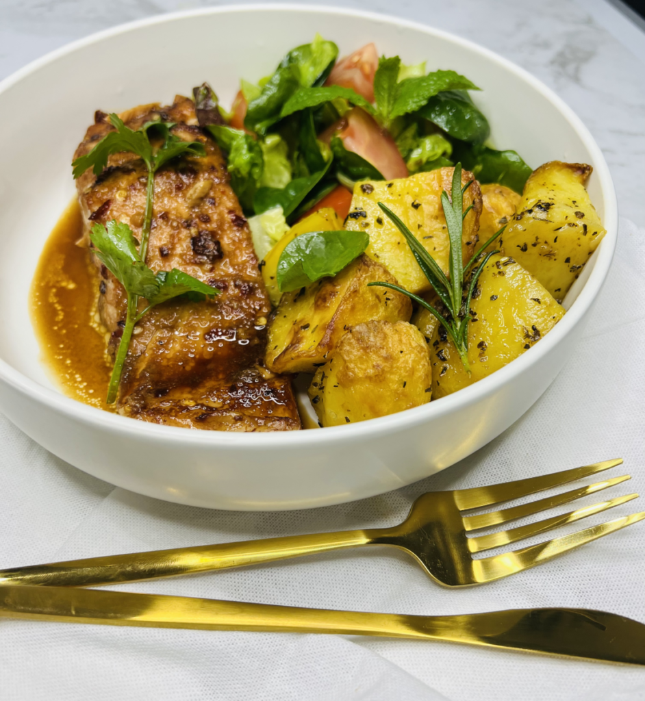 baked potatoes served with teriyaki salmon. 